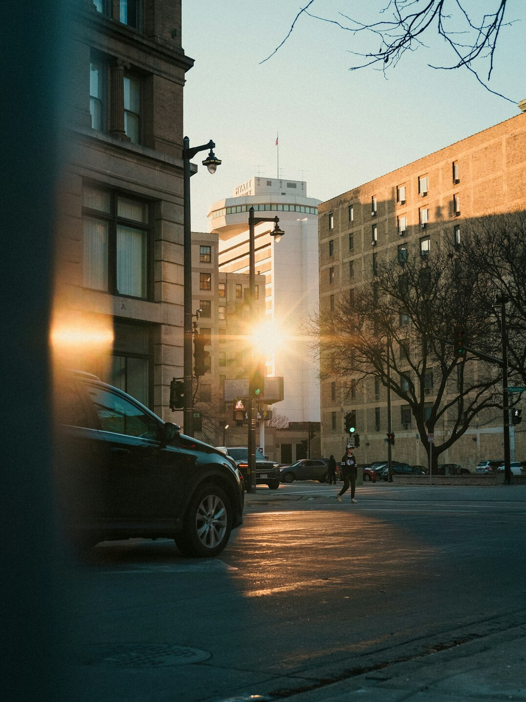 City street with buildings and traffic at dusk