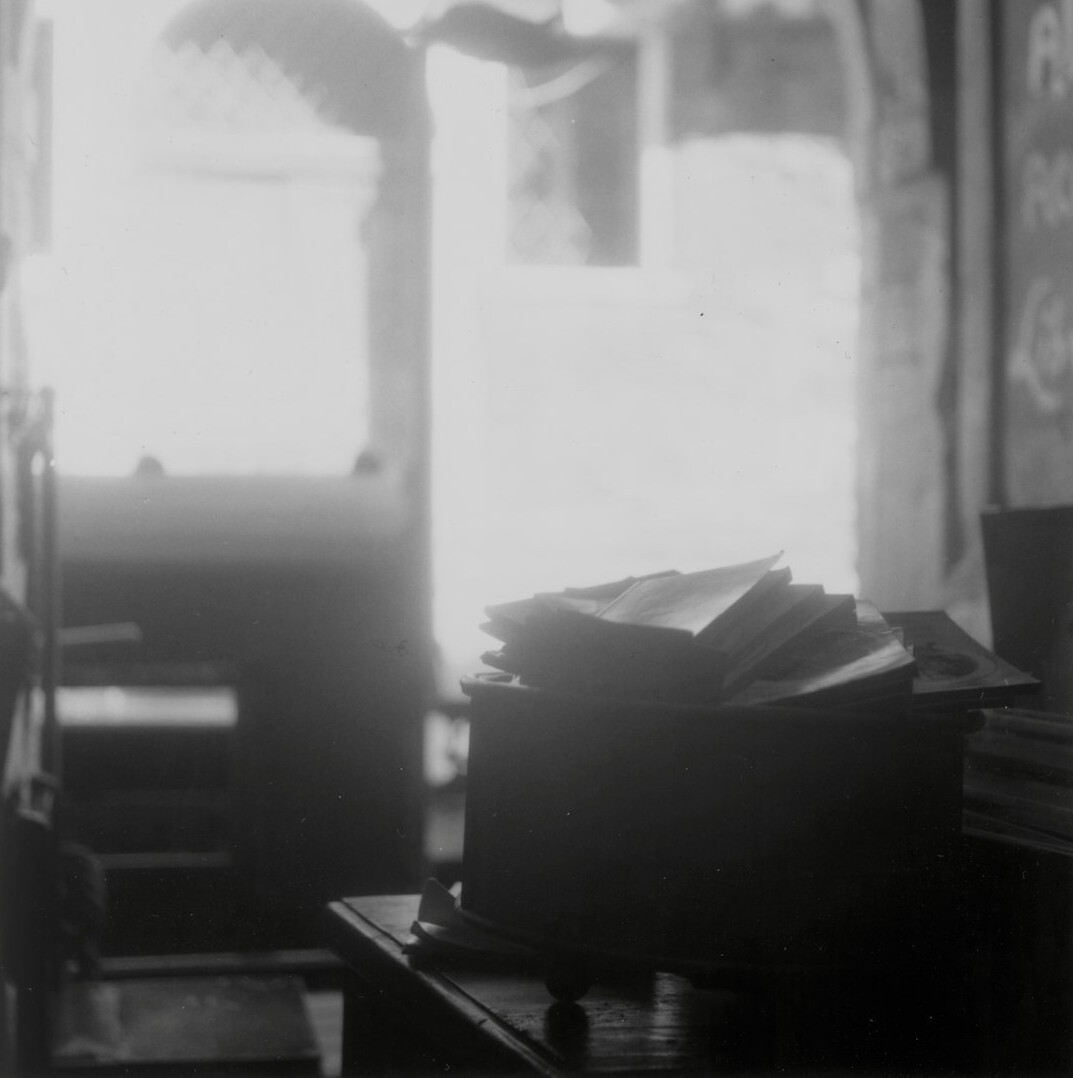 Documents and laptop on an investigative journalist's desk