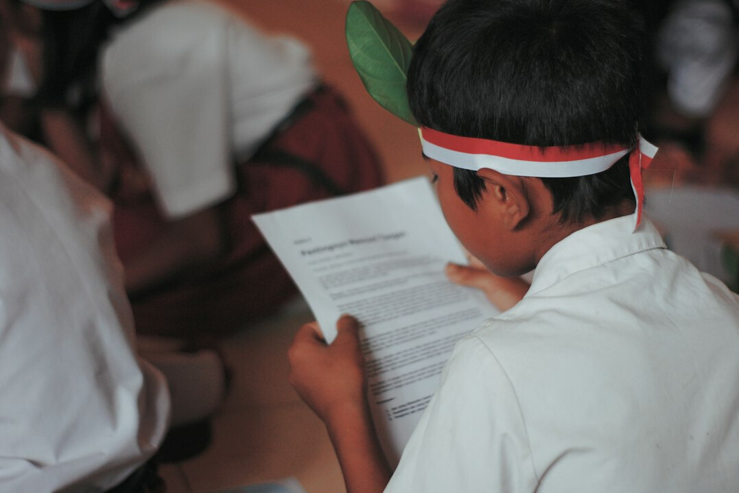 Person reviewing and signing official documents